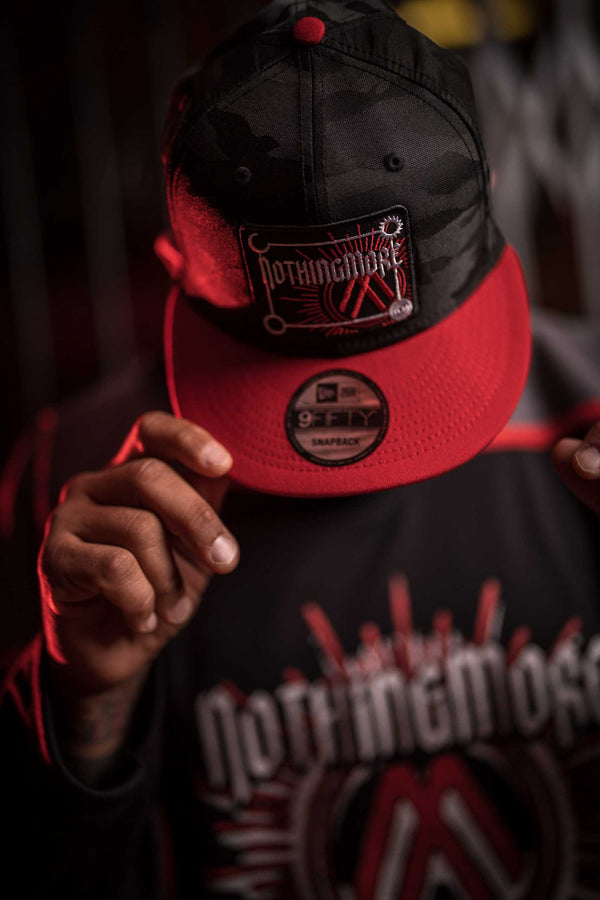 NOTHING MORE 'NEVERLAND' snapback hockey cap in black camo with red brim on model