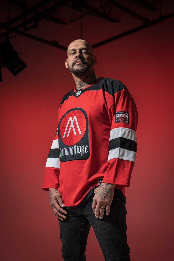 NOTHING MORE 'VALHALLA' deluxe hockey jersey in red, black, and white front view on male model