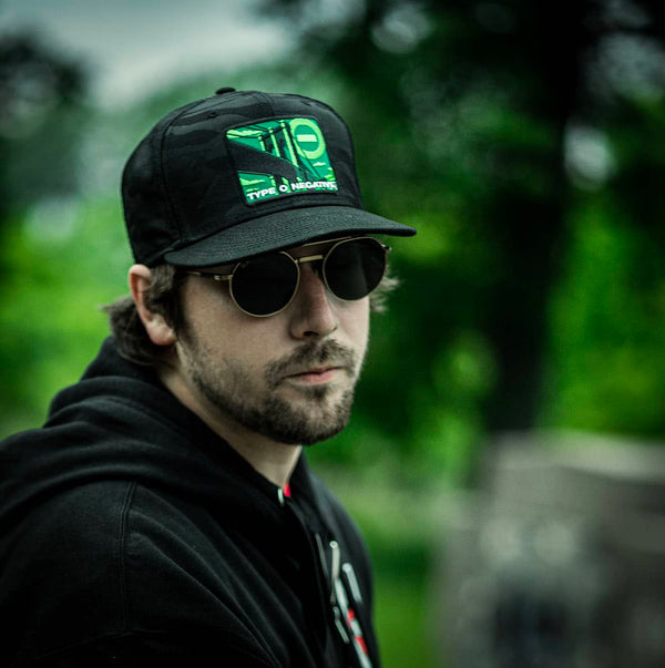 TYPE O NEGATIVE 'BRIDGE' snapback hockey cap in black camo front view on male model
