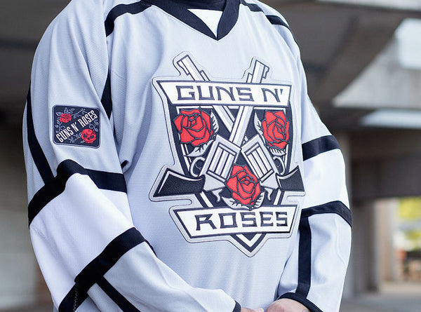 GUNS N' ROSES 'THE KINGS' deluxe hockey jersey in grey, black, and white front view on model