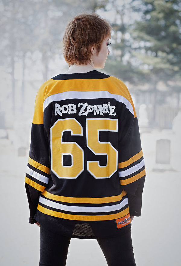 ROB ZOMBIE 'MARS NEEDS HCKY' hockey jersey in black, gold, and white back view on model