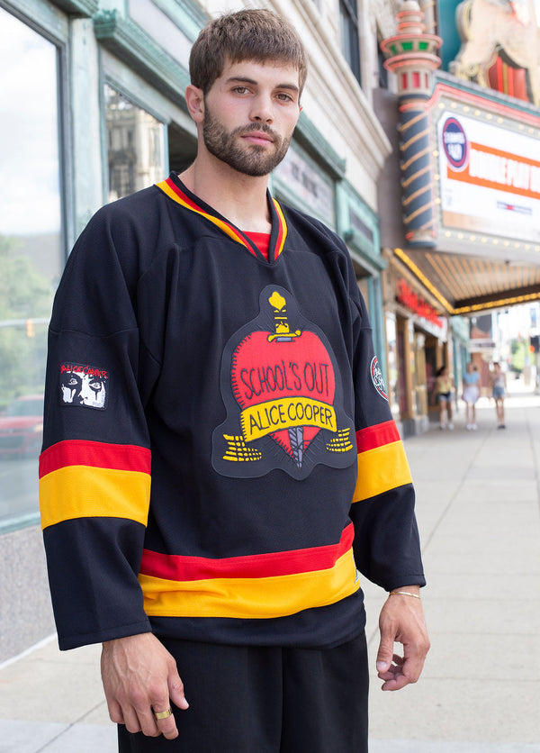 ALICE COOPER 'SCHOOLS OUT' deluxe hockey jersey in black, gold, and red front view on model