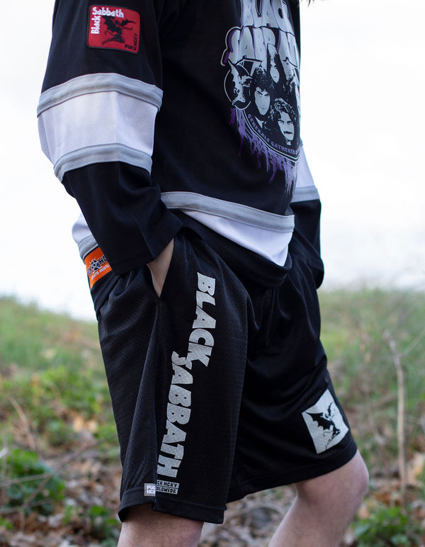 BLACK SABBATH ‘IRON MAN’ mesh hockey shorts in black on model