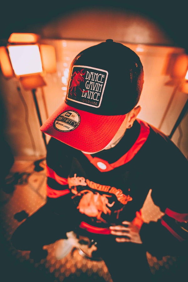 DANCE GAVIN DANCE 'AFTERBURNER' stretch fit hockey cap in black with red brim and stripes on model