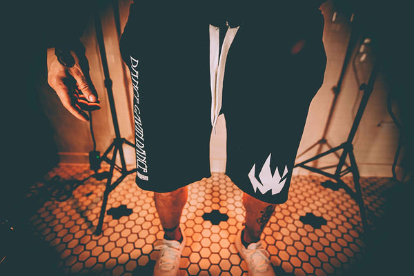 DANCE GAVIN DANCE 'MIDNIGHT CRUSADE' fleece hockey shorts in black front view on model