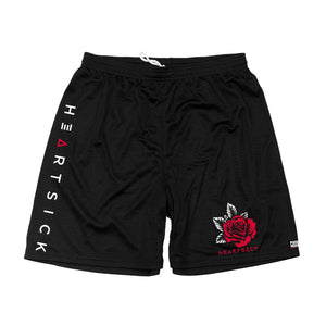 HEARTSICK ‘THE SNAKE AND THE ROSE’ mesh hockey shorts in black front view