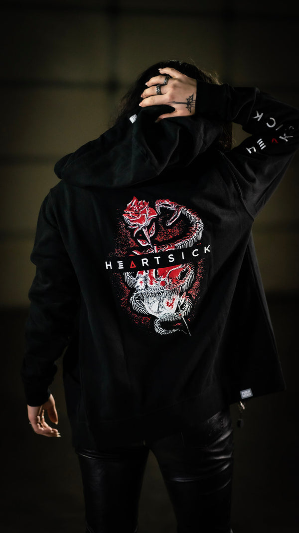 HEARTSICK ‘THE SNAKE AND THE ROSE’ full zip hockey hoodie in black back view on model