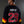 POPEYE 'STRONG TO THE FINISH' deluxe hockey jersey in black, red, and gold back view on model