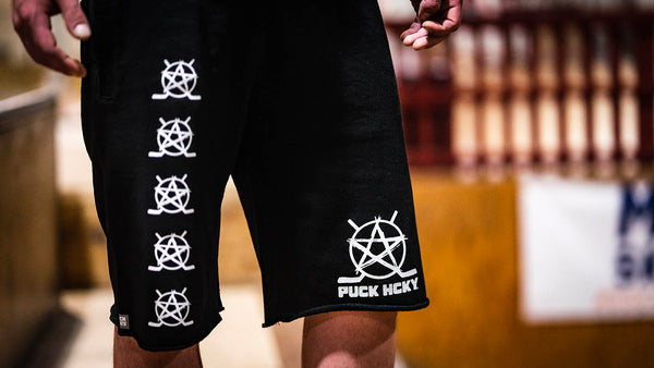 PUCK HCKY ‘BIG STAR’ fleece hockey shorts in black front view on model