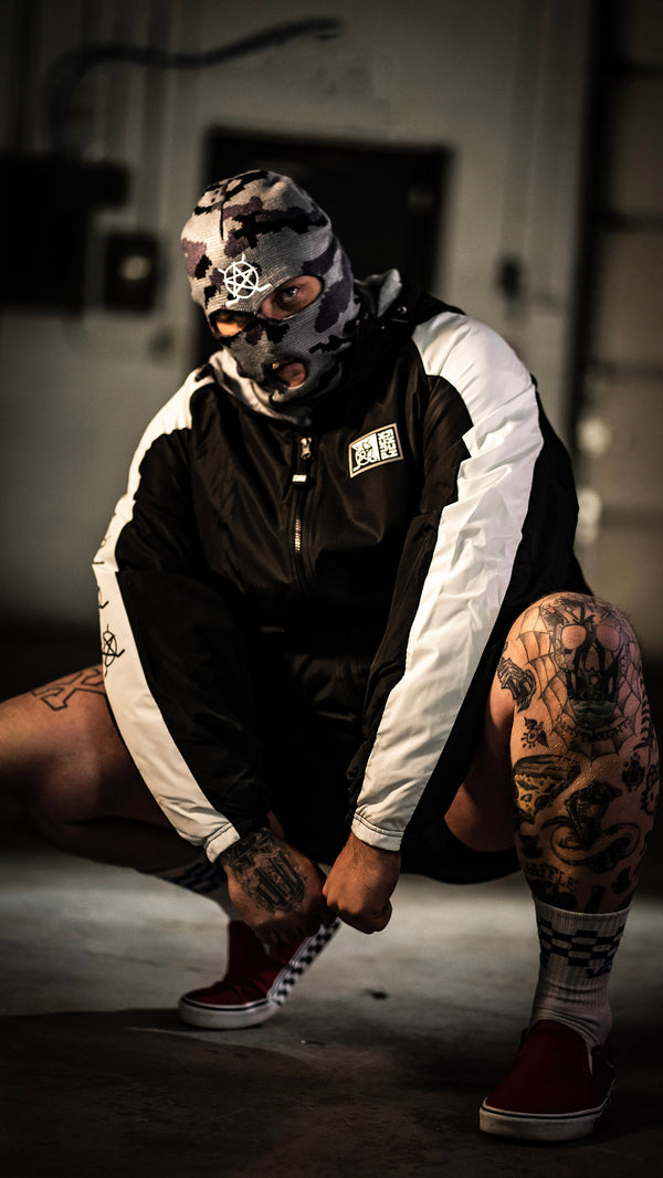 PUCK HCKY 'BIG STAR' zip-up hockey homefield jacket in black and white front view on model