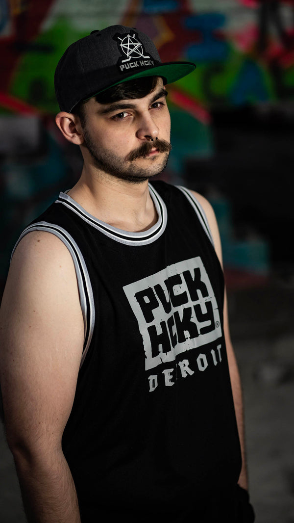 PUCK HCKY 'DETROIT' sleeveless summer league jersey in black, grey, and white front view on model