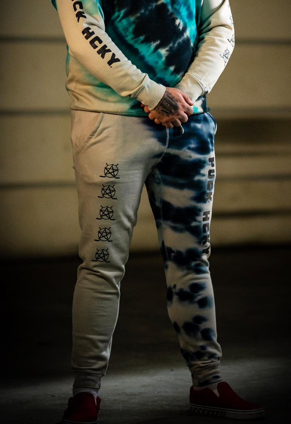PUCK HCKY 'EQUIPMENT HAZMAT' limited edition hockey joggers in bone with custom tie-dye front view on model