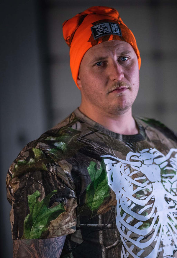 PUCK HCKY ‘SLICED N’ STACKED’ high vis hockey beanie in orange real tree camo on model