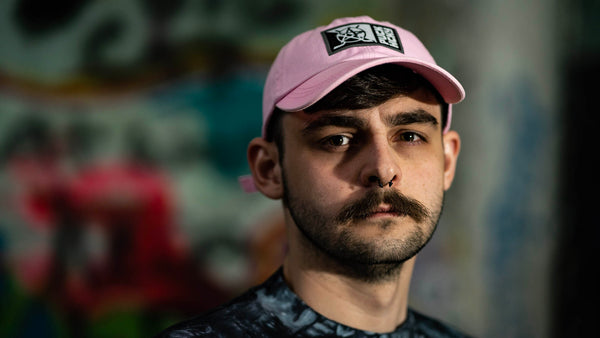 PUCK HCKY 'SLICED AND STACKED' hockey Dad hat in pink front view on model