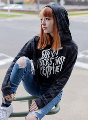 PUCK HCKY 'SHOOT PUCKS NOT PEOPLE - STACKED' women's pullover crop hockey hoodie in black camo on model