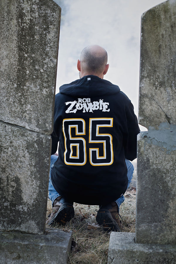 ROB ZOMBIE 'MARS NEEDS HCKY' pullover hockey hoodie in black back view on model