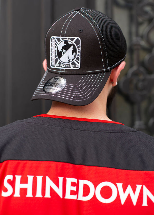 SHINEDOWN 'PLANET ZERO' stretch mesh contrast stitch hockey cap in black with white stitching on model