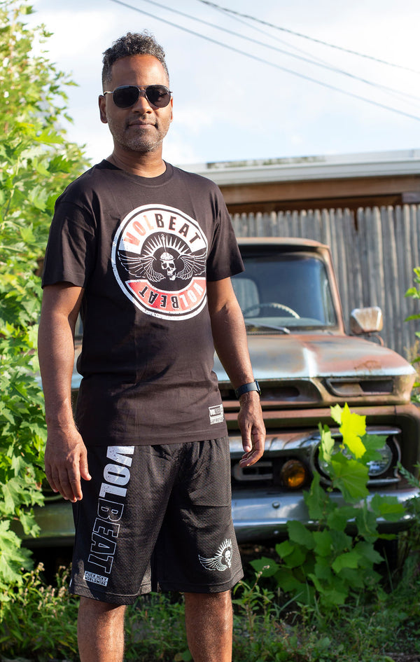 VOLBEAT ‘7 SHOTS’ mesh hockey shorts in black front view on model