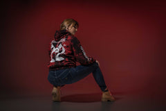 NOTHING MORE 'SPIRITS' pullover hockey hoodie in red and black tie-dye back view on female model