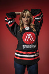 NOTHING MORE 'VALHALLA' deluxe hockey jersey in black, red, and white front view on female model