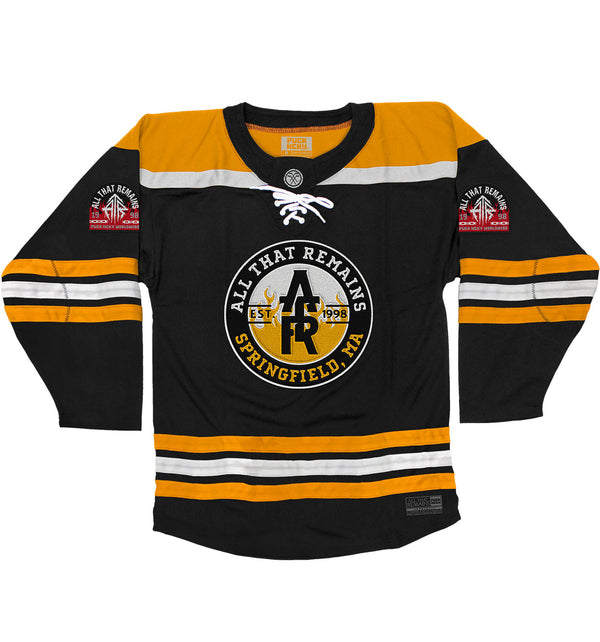 All That Remains 'Puckfire' hockey jersey in black, gold, and white front view
