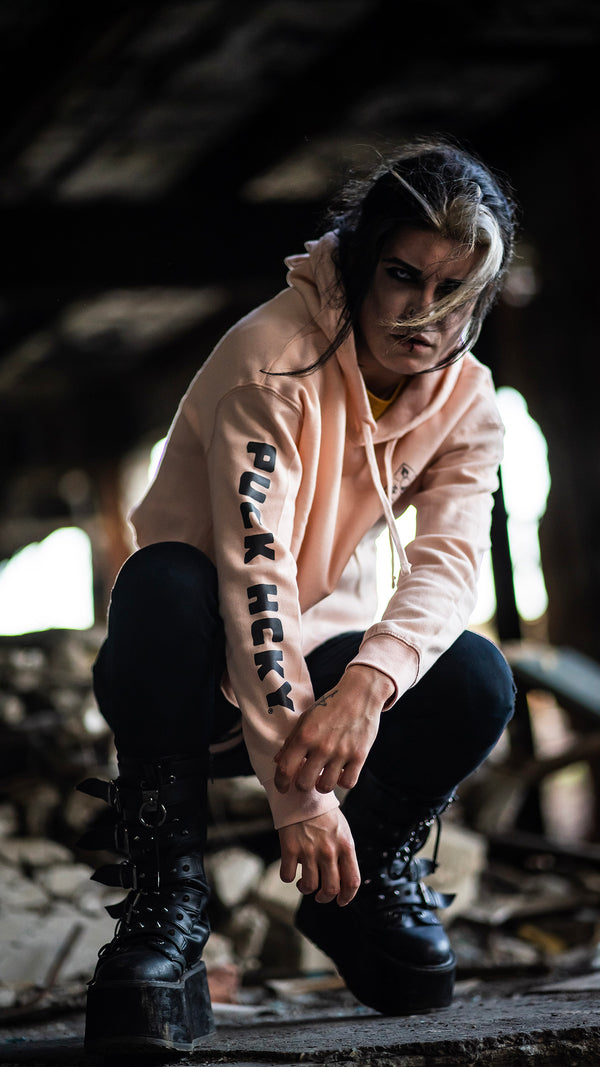 PUCK HCKY 'EQUIPMENT HAZMAT' women's cropped hockey hoodie in blush front view on model