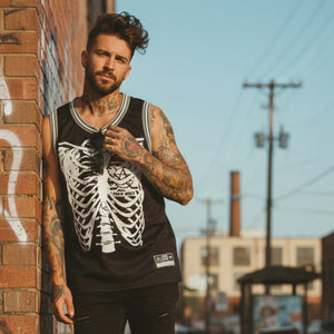 PUCK HCKY 'RIB CAGE' sleeveless basketball jersey in black, grey, and white on model