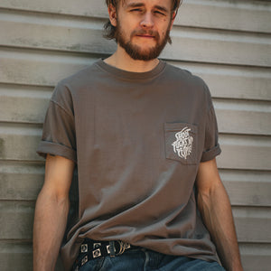 PUCK HCKY 'SHOOT PUCKS NOT PEOPLE - DRIPPY SCRIPT' short sleeve hockey pocket t-shirt in cinder front view on model