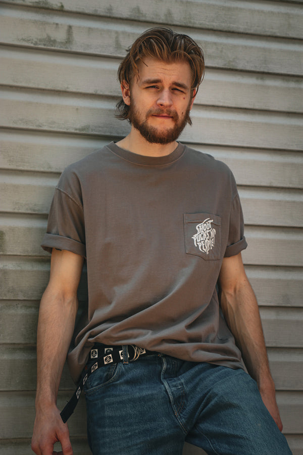 PUCK HCKY 'SHOOT PUCKS NOT PEOPLE - DRIPPY SCRIPT' short sleeve hockey pocket t-shirt in cinder front view on model