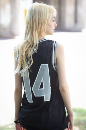 PUCK HCKY 'Shoot Pucks Not People - Eagle Worldwide' sleeveless basketball jersey in black, grey, and white back view on model