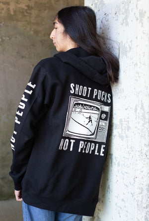 PUCK HCKY 'Shoot Pucks Not People - Television' full zip hockey hoodie in black back view on model