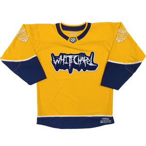 WHITECHAPEL 'REPROGRAMMED TO SKATE' hockey jersey in gold, navy, and white front view