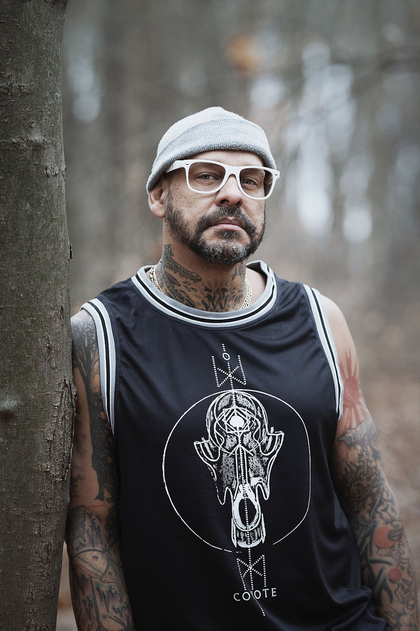 TOTEM 'Coyote' sleeveless basketball jersey in black, grey, and white on model