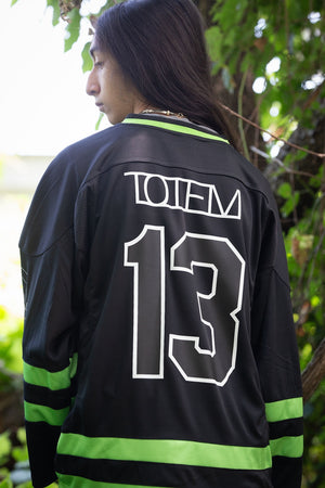 TOTEM 'Freya' hockey jersey in black and neon green back view on model