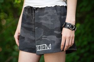 TOTEM 'Logo' women's fleece shorts in black camo on model close up
