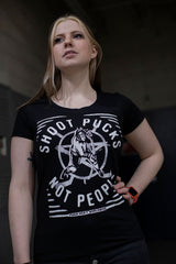 PUCK HCKY 'SHOOT PUCKS NOT PEOPLE - THE BIG SKATE' women's short sleeve hockey t-shirt in black on model front view