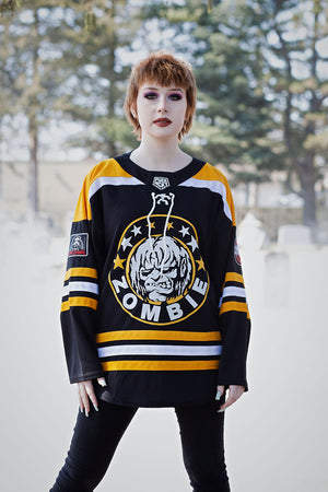 ROB ZOMBIE 'MARS NEEDS HCKY' hockey jersey in black, gold, and white front view on model