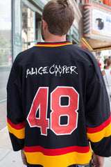 ALICE COOPER 'SCHOOLS OUT' deluxe hockey jersey in black, gold, and red back view on model