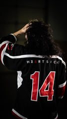 HEARTSICK 'THE SNAKE AND THE ROSE' hockey jersey in black, white, and red back view on model