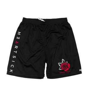 HEARTSICK ‘THE SNAKE AND THE ROSE’ mesh hockey shorts in black front view
