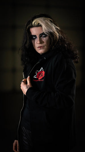 HEARTSICK ‘THE SNAKE AND THE ROSE’ full zip hockey hoodie in black front view on model