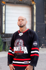 PANTERA 'STRONGER THAN ALL' deluxe hockey jersey in black, red, and white front view on model