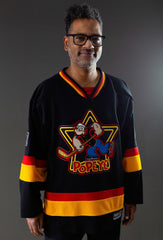 POPEYE 'STRONG TO THE FINISH' deluxe hockey jersey in black, red, and gold front view on model
