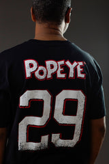 POPEYE 'STRONG TO THE FINISH' short sleeve hockey t-shirt in black back view on model