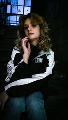PUCK HCKY 'BIG STAR' zip-up hockey homefield jacket in black and white front view on female model
