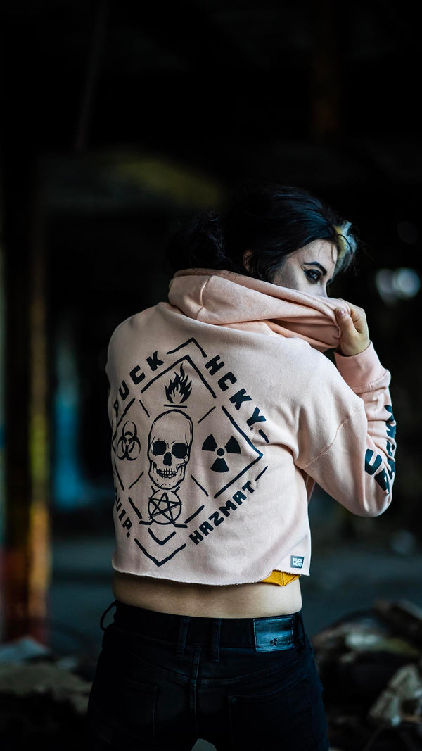 PUCK HCKY 'EQUIPMENT HAZMAT' women's cropped hockey hoodie in blush back view on model