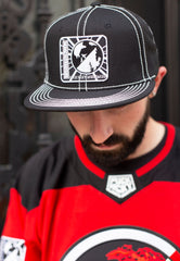 SHINEDOWN 'PLANET ZERO' contrast stitch snapback hockey cap in black with white stitching on model