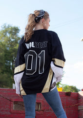 VOLBEAT ‘REWIND REPLAY REBOUND’ hockey jersey in black, white, and vegas gold back view on model
